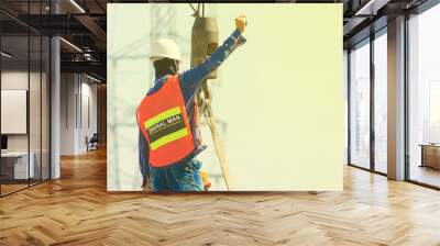 The crane signer is giving the construction contract signal. Wall mural