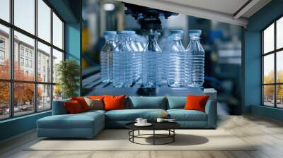 Automated machinery shapes and molds plastic bottles in factory setting, showcasing efficiency of modern manufacturing processes. scene highlights precision and technology involved in production Wall mural