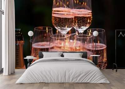 Champagne flutes with sparklers and Christmas ornaments for a festive celebration. Wall mural