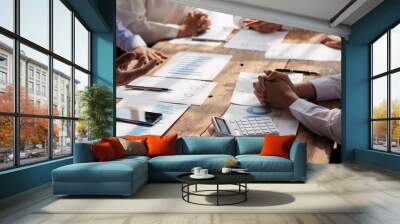 Teamwork with businessman analyzing cost graphs on table at conference room. Wall mural