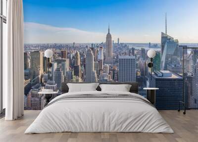 Panoramic photo of New York City Skyline in Manhattan downtown with Empire State Building and skyscrapers on sunny day with clear blue sky USA Wall mural