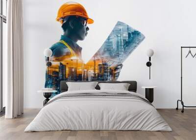 A man in an orange hard hat is reading a blueprint Wall mural