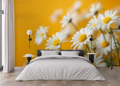 Bright white daisies bloom against a cheerful yellow backdrop, creating a vibrant and uplifting floral scene. Wall mural