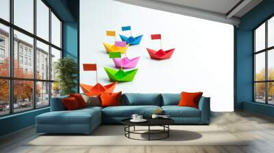 Business competition concept with Colorful paper ships on white background Wall mural