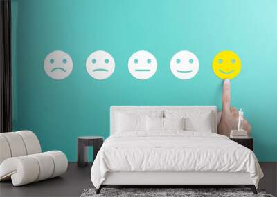 client's hand picked the happy face smile face, Customer service evaluation and satisfaction survey concept. copy space Wall mural