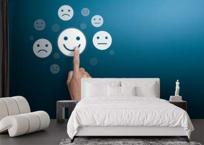 Customer service experience and satisfaction survey concepts. The client's hand choose the happy face smile face with copy space Wall mural