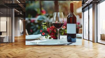 Elegant dining table with a bottle of red wine and a glass on a restaurant terrace Wall mural