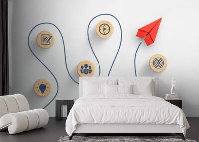 Red paper plane and wooden cubes with business strategy icons on white background Wall mural