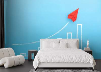 Red paper plane with growing a sketch graph on blue background, Growth and successful concept. Wall mural