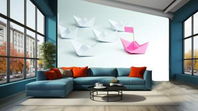 Woman Leadership concept with pink paper ship leading among white on white background. Wall mural