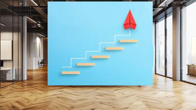 Wooden block stacking as step stair with red paper plane on blue background, Ladder of success in business growth concept, copy space Wall mural