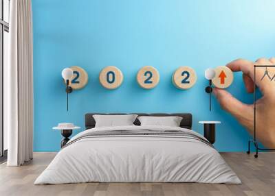 Wooden blocks with new year 2022, arrow up icons, Business development and growth 2022 concept Wall mural