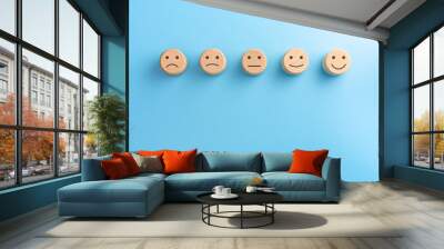 Wooden blocks with the happy face smile face symbol on blue background, evaluation, Increase rating, Customer experience, satisfaction and best excellent services rating concept with copy space Wall mural