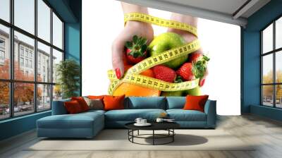 woman hands with fruit  bond with measuring tape slave to diet Wall mural