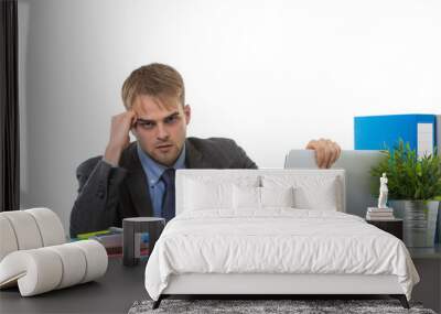 young desperate businessman overworked and upset looking worried and angry sitting at computer desk Wall mural