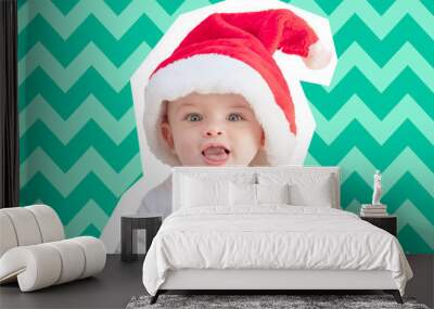 Magazine collage paper cut style portrait of a baby boy wearing a red Santa hat on a biscay green mint chevron background - fun Christmas card Wall mural