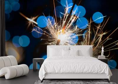 two classic sparklers with blue blurred bokeh lights - new year celebration party Wall mural