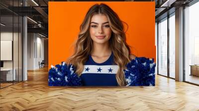 young woman in a white and blue cheerleader costume with stars on an orange background for Halloween Wall mural