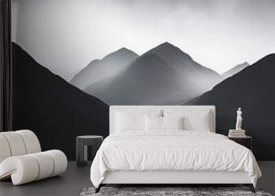 A black and white photograph showcasing a stunning view of mountain silhouettes against a misty backdrop Wall mural