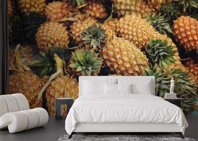 Fresh pineapple tropical fruit on the shelf for sale in the market  Wall mural