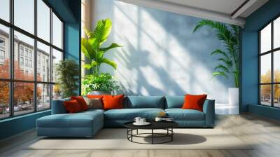 Sunlit Minimalism: A serene and minimalist interior design, featuring a large window bathing a light blue wall in warm sunlight. Two potted plants add life and vibrancy to the space, with long shadows Wall mural