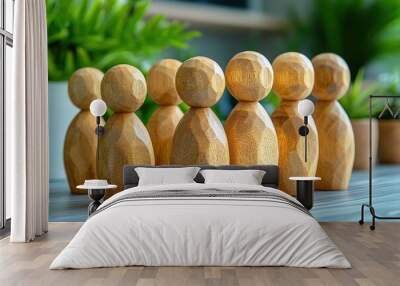 Wooden Figures in a Row: A captivating image of meticulously crafted wooden figurines standing in a row, symbolizing unity, community, or a team. Wall mural