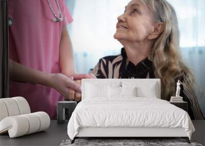 Caregiver for an elderly woman Weekly check-ups at the patient's residence. Ready to give medical advice and talk about various stories, exchange each other happily. Wall mural