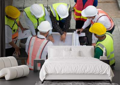 Construction engineers, architects, and foremen form a group. Participate in a meeting to plan new construction projects. Wall mural