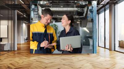 Engineers and auto repair technicians must use technology to detect faults in the operation of the engine of customer cars brought to repair in the garage. Wall mural