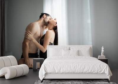 Gorgeous sexy couple enjoying sex in the house's bedroom, Concept of as emotional relationships passion and love Wall mural