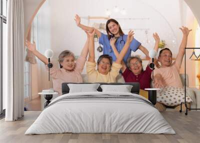 Group of Asian senior and caregiver having fun in the nursing home. Wall mural