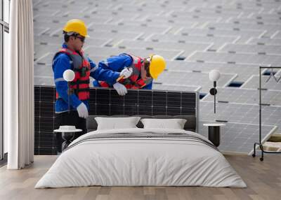 Photovoltaic engineers work on floating photovoltaics. Inspect and repair the solar panel equipment floating on the water. Wall mural