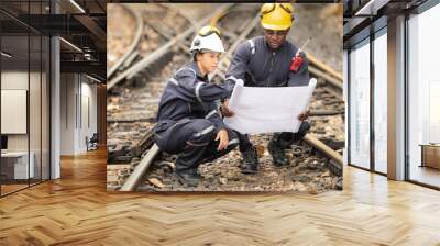 Railway technicians and engineers, Working on the train tracks at train station Wall mural