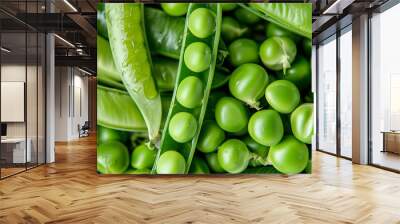 Close up of fresh green peas in pods Wall mural