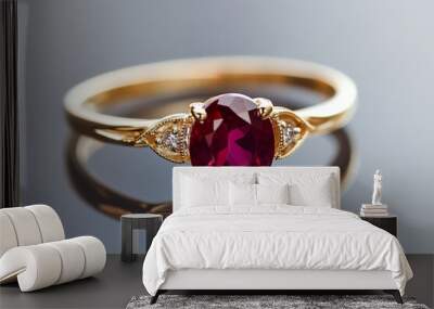 Elegant gold ring featuring a stunning oval ruby and sparkling diamonds set against a reflective background Wall mural