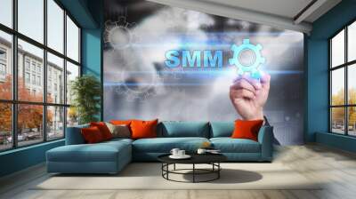 Businessman is drawing on virtual screen. smm concept. Wall mural