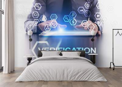 Businessman is using tablet pc and selecting Verification icon. Wall mural