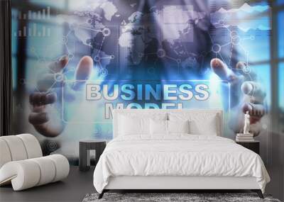 Businessman using tablet pc and selecting business model. Wall mural