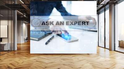 Businessman working in office, pressing button on virtual screen and selecting ask an expert. Wall mural