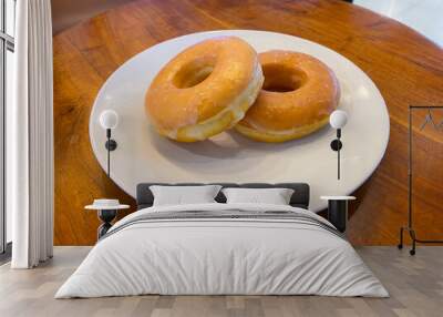 Two Glazed Donuts on a White Plate Wall mural