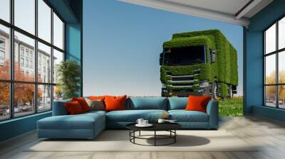 Eco friendly transportation concept. 3d rendering of a green truck on fresh spring meadow with blue sky in background - 3D Illustration Wall mural