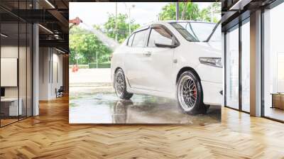 Car wash with flowing water and foam. Wall mural