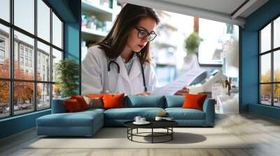 Female pharmacist reading on a paper with copy space Wall mural