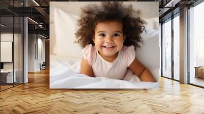 Happy healthy playful little cute adorable baby girl lying on comfortable bed or crib soft sheet. Smiling small sweet funny mixed race infant child laughing at home. Close up view, generative ai Wall mural