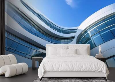 Modern Architectural Marvel: A symphony of glass and curves against a vibrant blue sky.  Wall mural