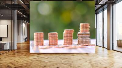 Stacks of gold money coin on table background and concept saving money, business growth strategy of money concept, advertising coins of finance and banking Wall mural