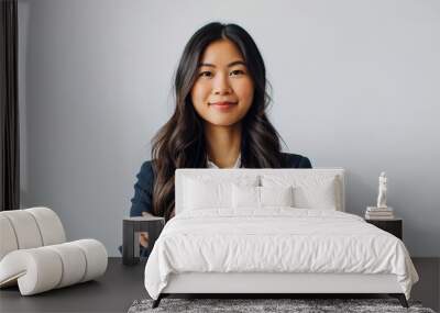 Young asian woman, professional entrepreneur standing in office clothing, smiling and looking confident, white background Wall mural