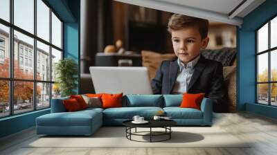 Young Entrepreneur: A young boy in a suit, focused intently on his laptop, embodies the spirit of modern childhood ambition and digital literacy.  Wall mural