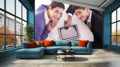 two businessmen playing on tablet computer Wall mural