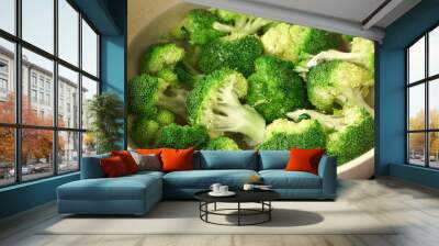 Fresh green broccoli in a bowl of water Wall mural